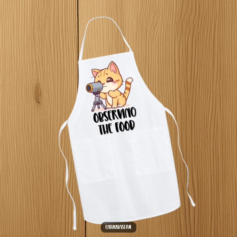 Funny cat apron with a character peering through a telescope, designed for curious culinary adventures.