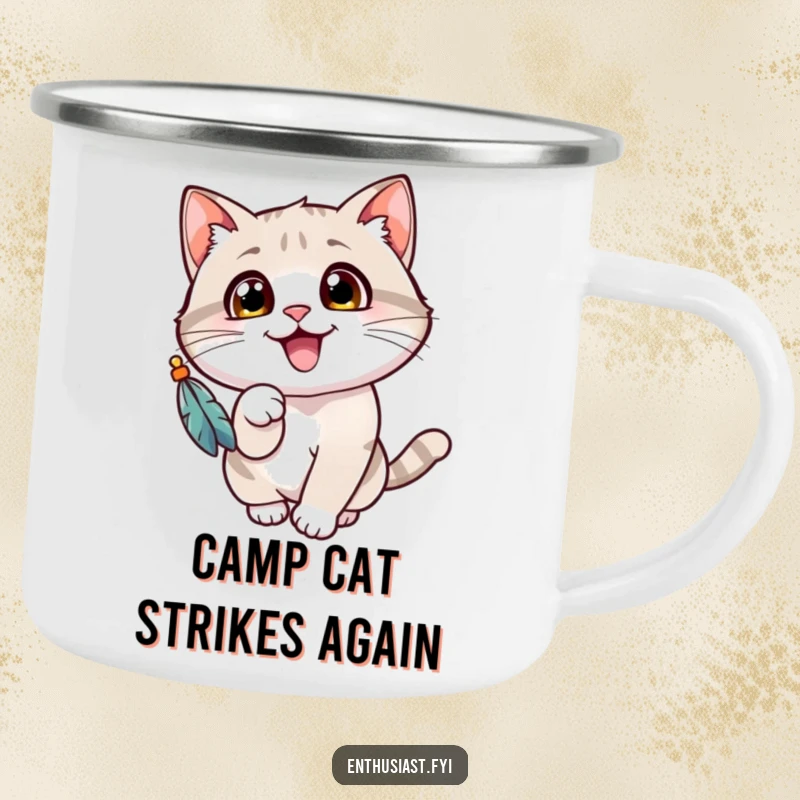 Funny cat camping mug showing a cheerful cat with wide eyes, gleefully batting at a dangling feathered toy, for outdoor fun.