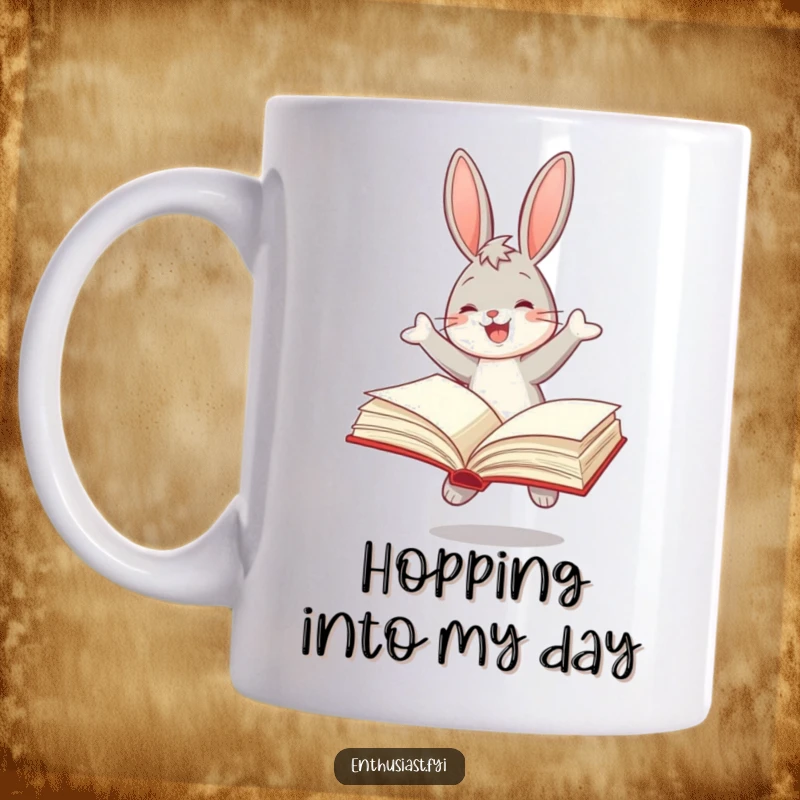 Funny mug depicting a joyful bunny enthusiastically bouncing with a large, open book, symbolizing a love for reading.