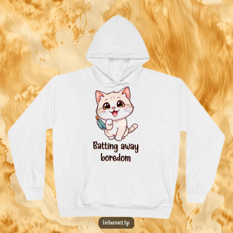 Funny cat hoodie featuring a cheerful cat with wide eyes, gleefully batting at a dangling feathered toy, ideal for cat enthusiasts.