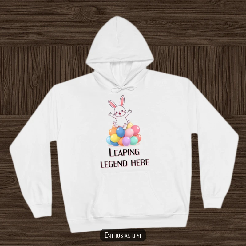 Funny hoodie depicting a rabbit enthusiastically leaping over colorful balloons, offering warmth and whimsical charm.