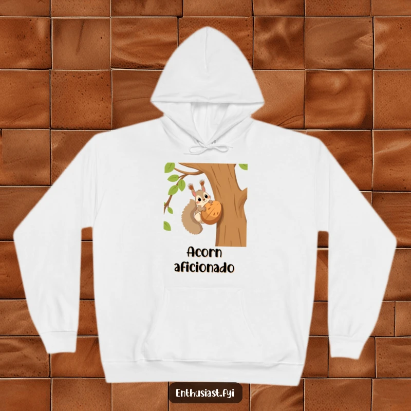 Funny squirrel hoodie showcasing a squirrel high in a tree, eyes wide with excitement over an enormous nut, a symbol of ultimate joy.