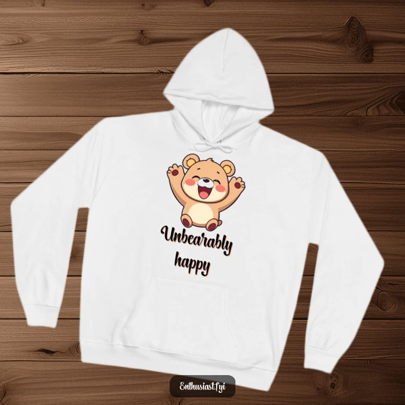 Funny hoodie showcasing a delighted bear character with both paws in the air, cheering with an enormous, infectious smile. Cozy and fun.