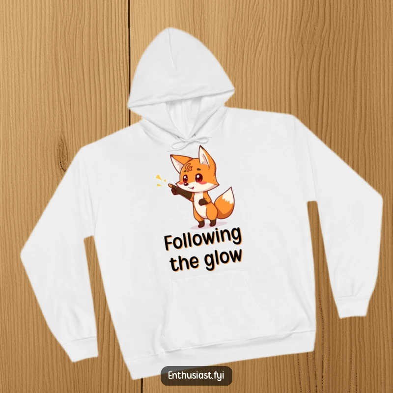 Funny hoodie depicting a curious fox character pointing with excitement at a bright, glowing sign, perfect for the avid explorer.
