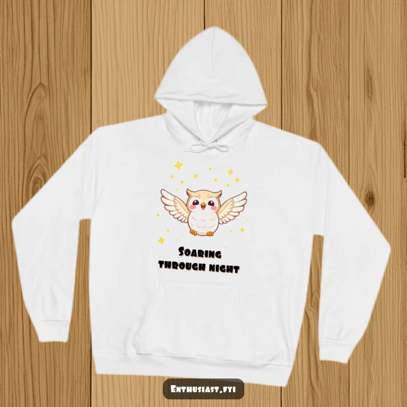 Funny hoodie with a joyful owl character soaring through a sky filled with twinkling stars, offering warmth and cosmic wonder.