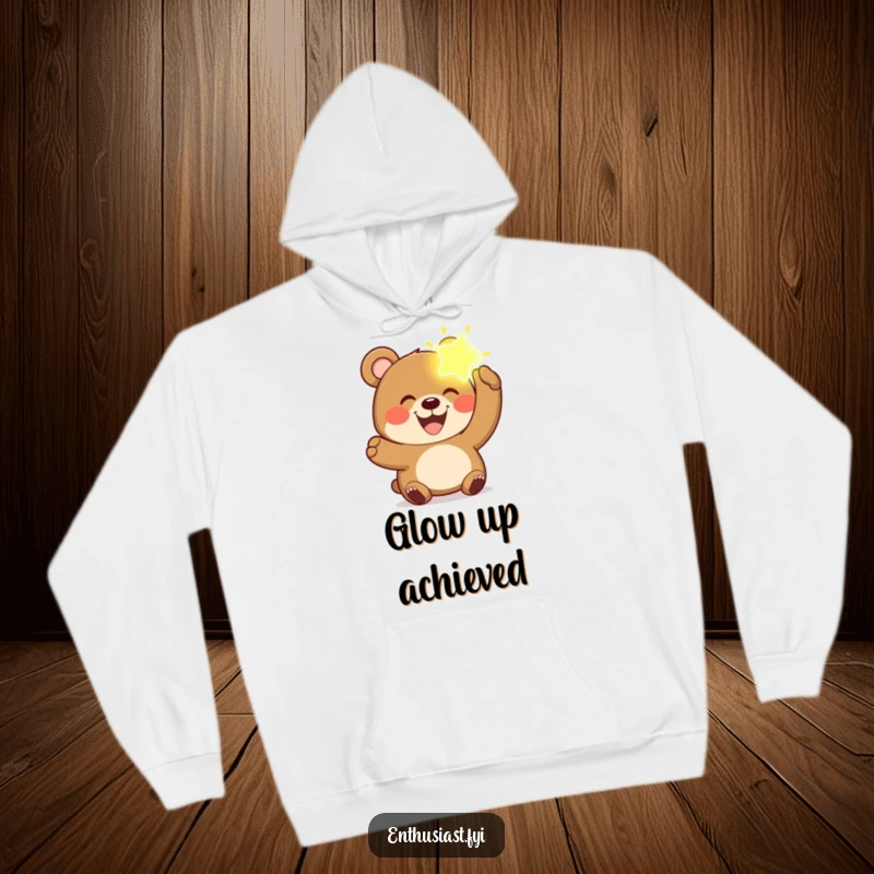 Funny bear hoodie featuring a joyful bear with a wide grin, holding a luminous, imagined object.