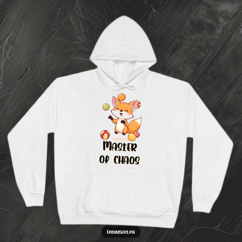 Funny fox hoodie featuring a cute, small fox juggling brightly colored balls with intense focus and a happy expression, ideal for cozy laughs.
