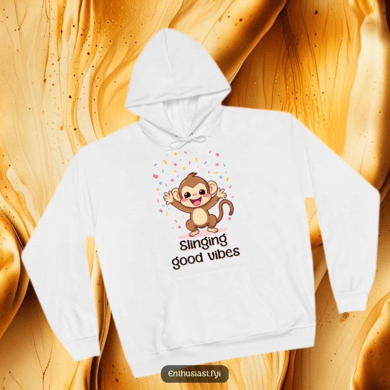 Funny monkey hoodie featuring a happy character throwing confetti, offering warmth and party vibes.