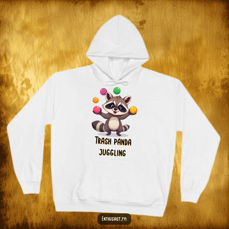 Funny comfy raccoon hoodie features a goofy raccoon juggling colorful balls, offering warmth and playful charm for relaxed moments.