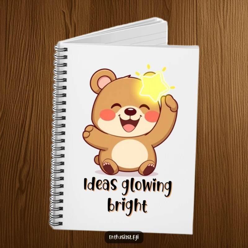 Funny bear notebook cover with a joyful bear holding a glowing, imaginary object for creative writing.