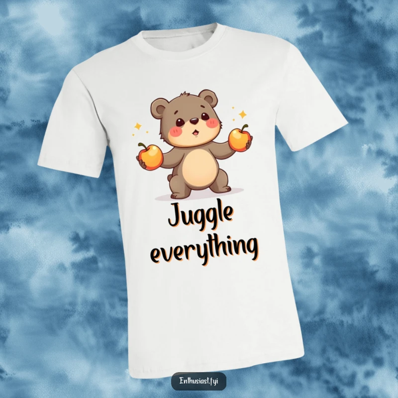 Funny bear cub t-shirt, depicting a determined cub enthusiastically juggling three shiny apples. A humorous apparel gift for performers.