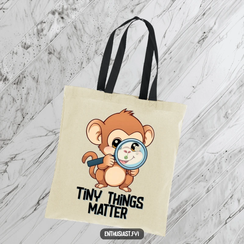Funny monkey tote bag with a curious monkey holding a magnifying glass, focused on a minute, elaborate item.